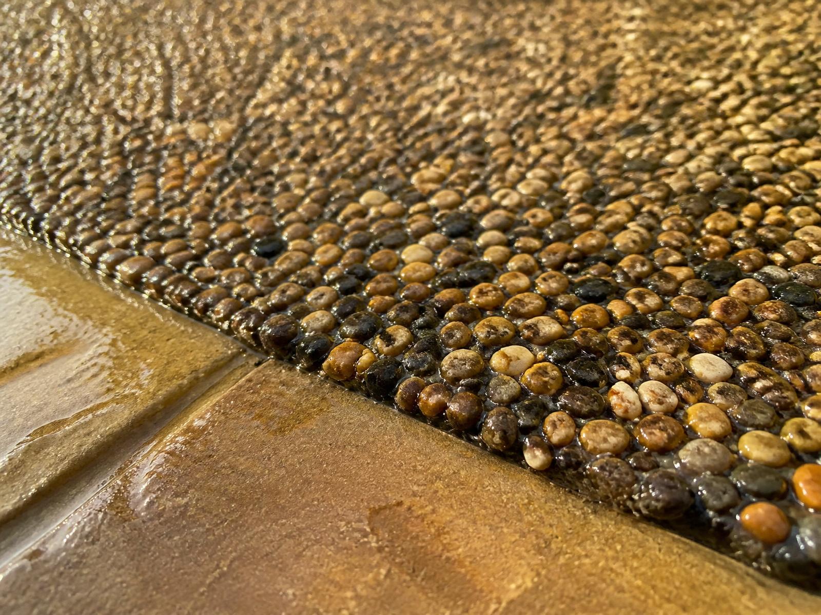 Close-up of resin-bound aggregate showing the wet-look bonded finish
